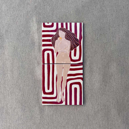 A Hand-Painted Tile Mural of a Female Nude on a Patterned Background